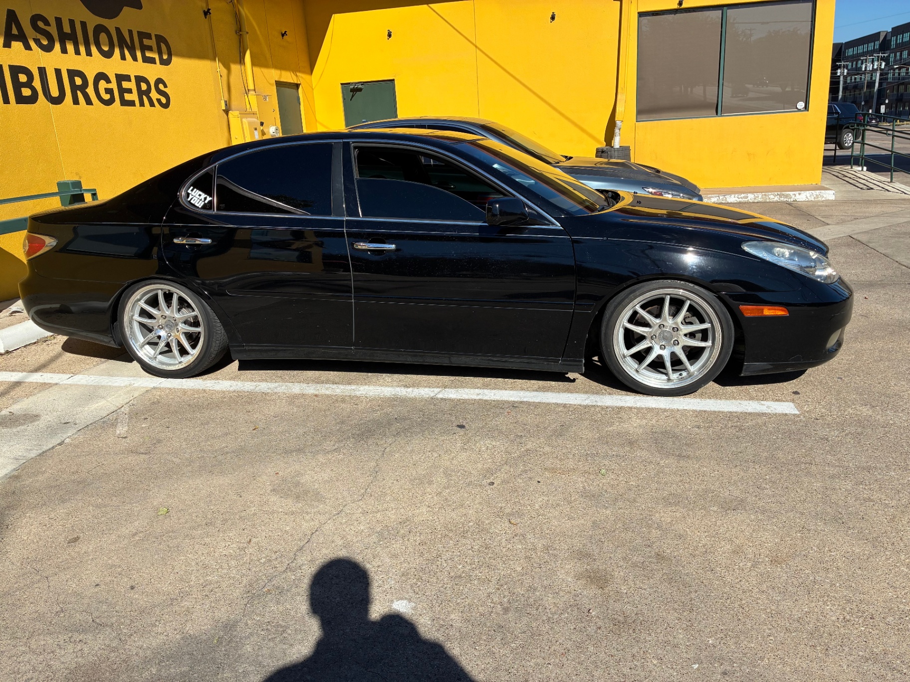 Black Lexus sedan side profile