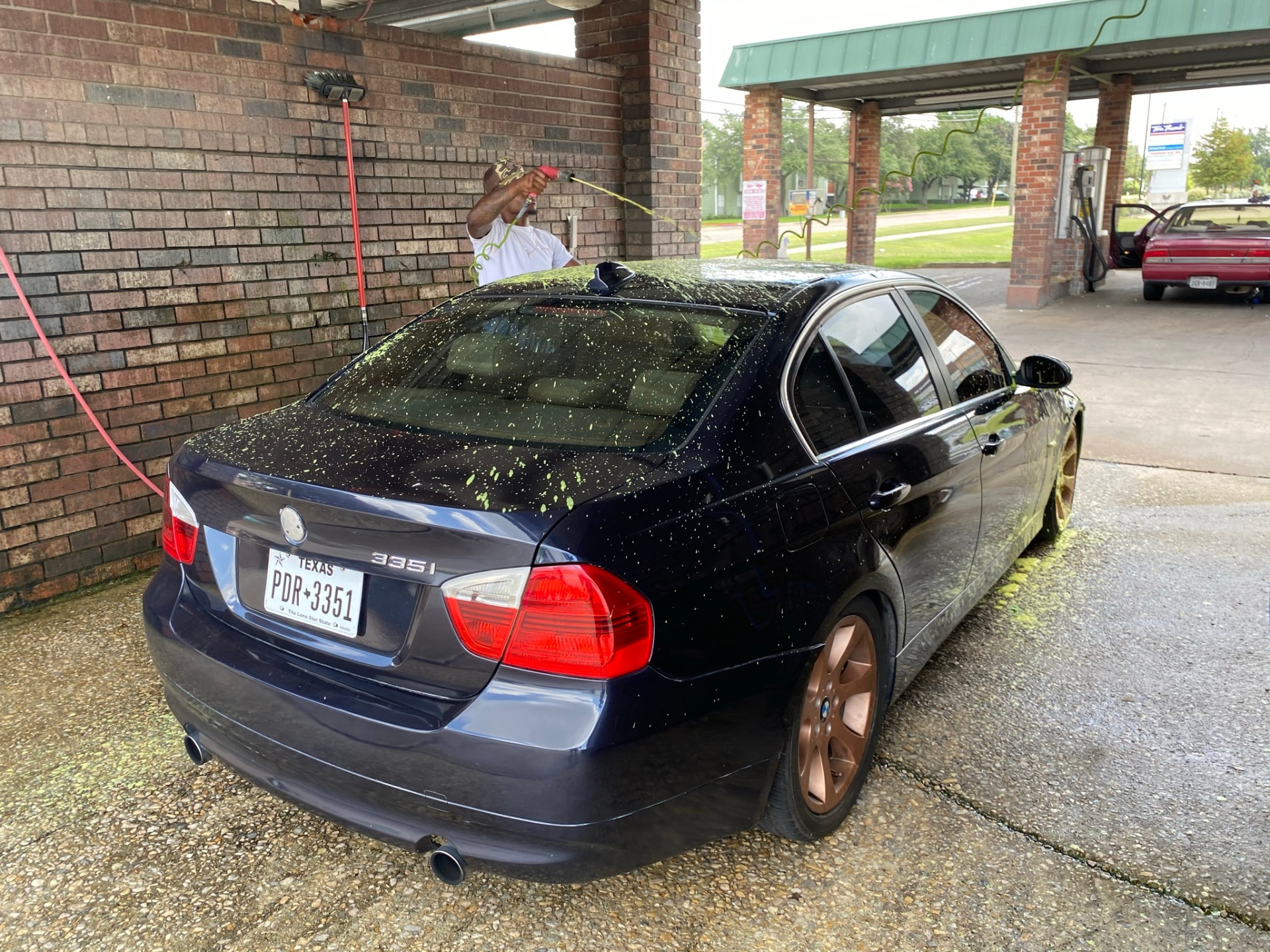 Black BMW 335i at a car wash