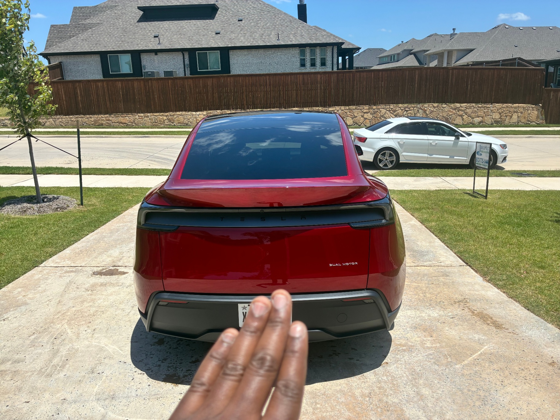 Red Tesla Model Y rear view, freshly cleaned