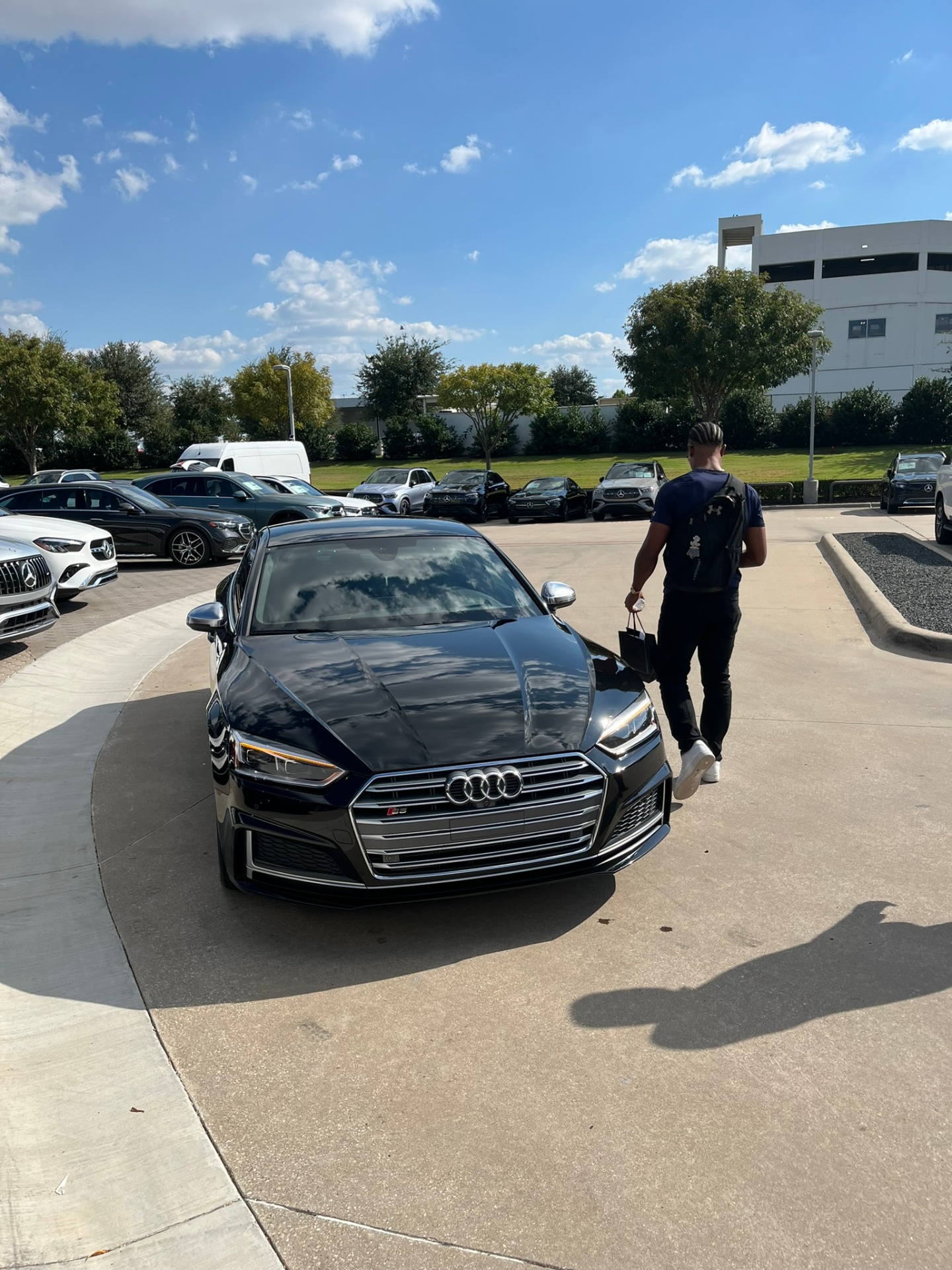Black Audi S5 in a parking lot
