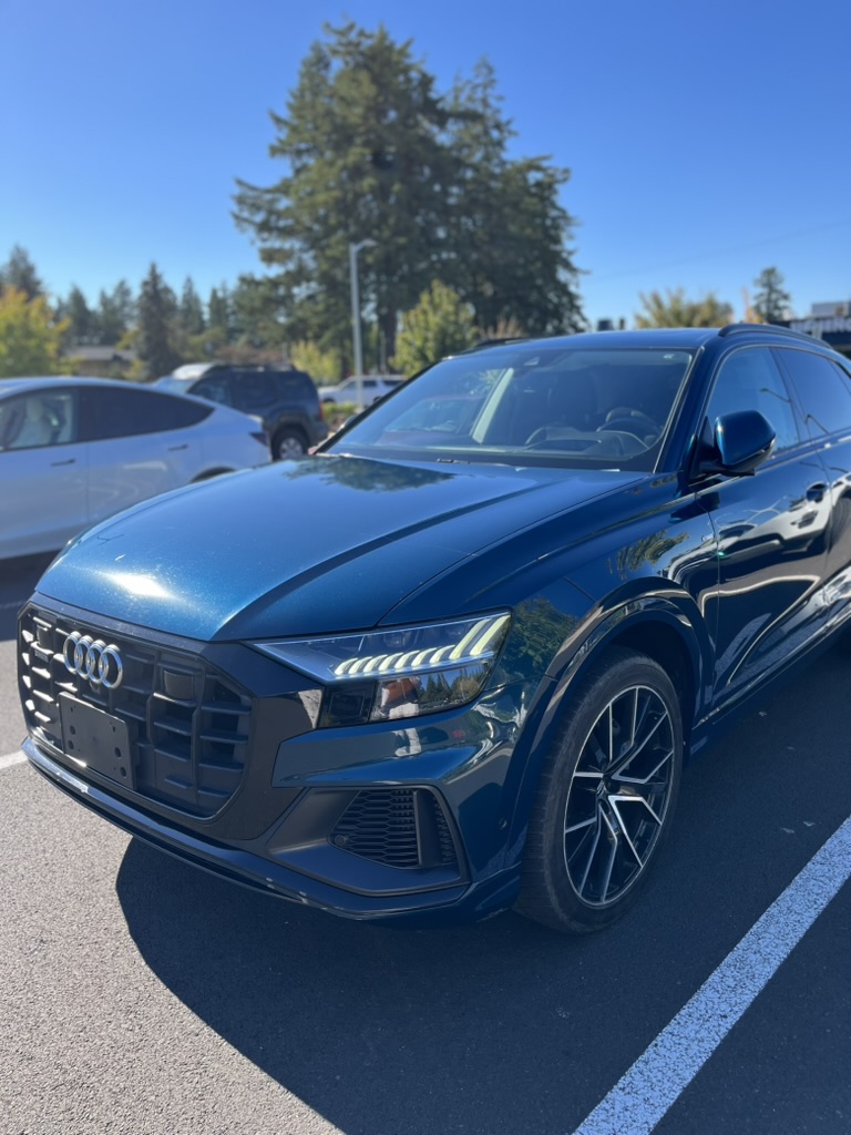 Blue Audi Q8 S-Line SUV parked in a lot