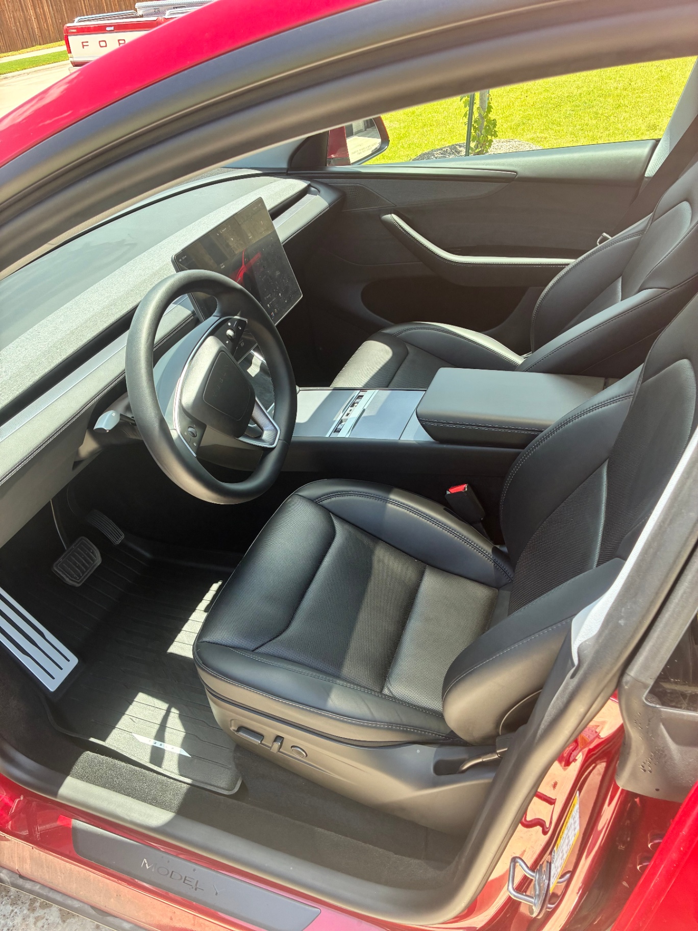 Tesla Model Y front interior, black seats detailed