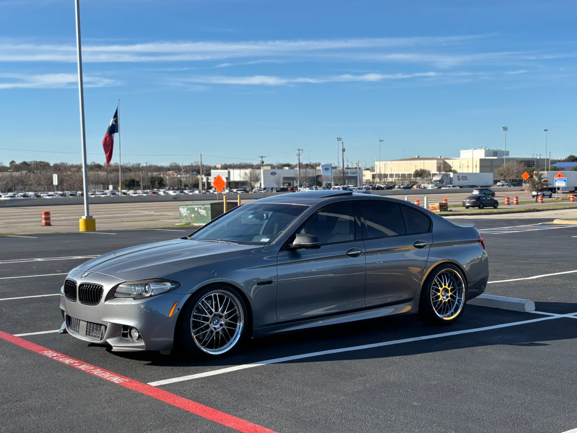 Gray BMW 5 Series on custom wheels